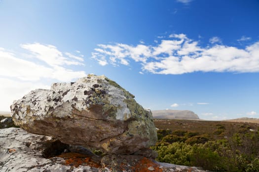 Rocky landscape and wide steppe with blue sky