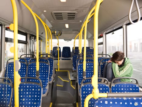 Sad woman alone on the bus