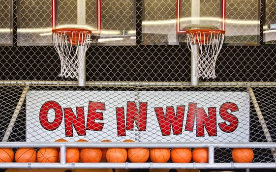 A basketball game of chance on a boardwalk
