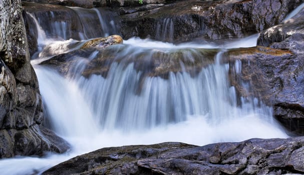 A small waterfall in a stream flowing down rocks