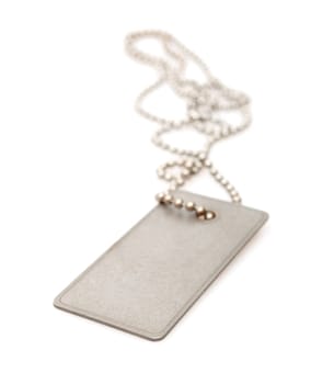 Shiny Blank Metallic Military Identification Plate on White Background With Shadow - Shallow Depth of Field