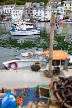 fishing boats in historic village Polperro in Cornwall. Cornish Harbor with boats and cottages