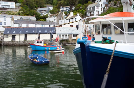 fishing boats in historic village Polperro in Cornwall. Cornish Harbor with boats and cottages
