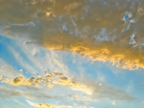 Clouds are illuminated by the setting sun