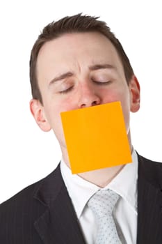 Businessman with postit note on mouth