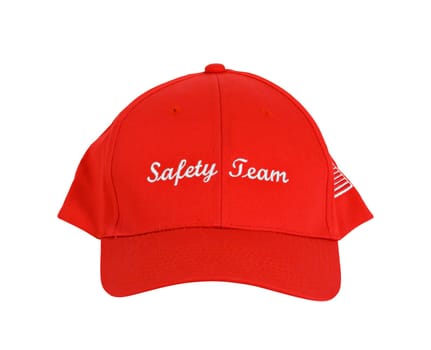 A red hat or cap with the words "Safety Team"" printed on the front"
