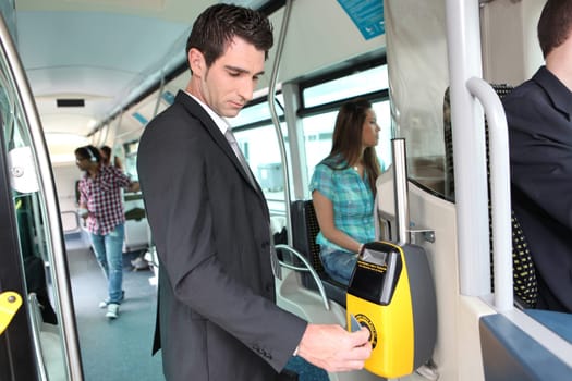 Businessman validating travel card