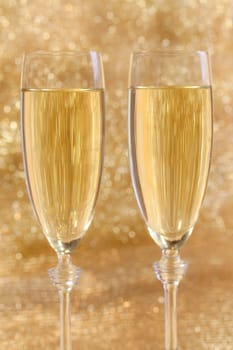 Champagne glasses with festive background