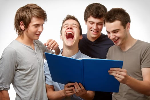 Four young people working and having fun together