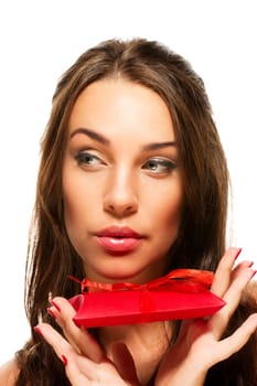 Beautiful woman holding gift and looking at the page on white background