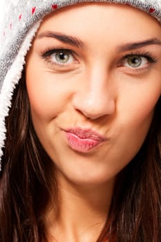 Close-up of a beautiful brunette woman pulling a snout