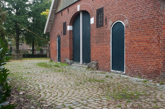classical dutch farm house with authentic green doors