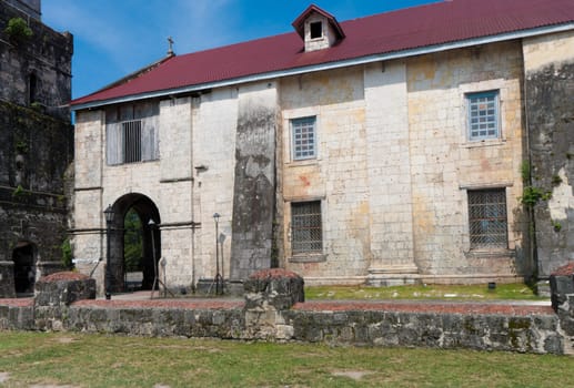 exterior of the Baclayon church on Bohol, Philippines. You can see the face of St. Padre Pio on the wall.