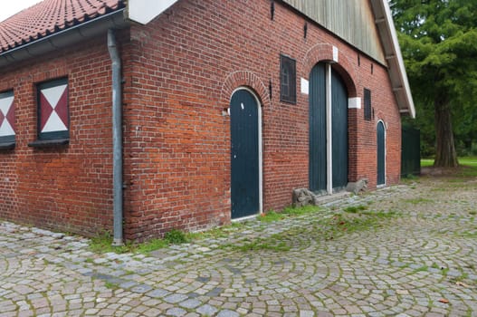 classical dutch farm house with authentic green doors