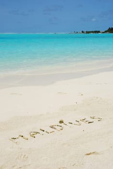 Maldives note written on a white sandy beach