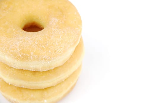 pile of delicious donuts isolated on white background (close up)