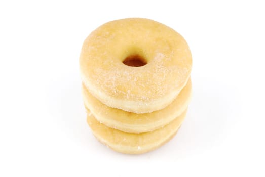 pile of delicious donuts isolated on white background (close up)