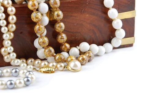 jewel box with pearl necklaces isolated on white background