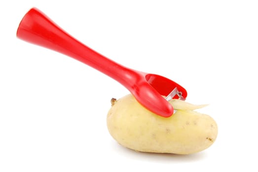 peeling a potato with peeler isolated on white background