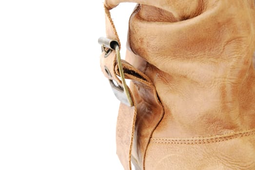 close-up of a women trendy brown leather boot isolated on white background