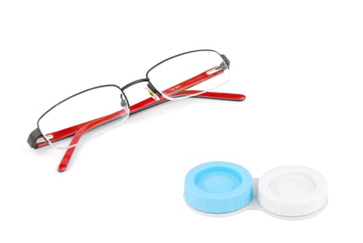 red glasses and eye contact lenses isolated on white background