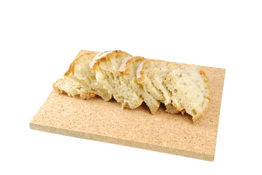 slices of cantle wheaten bread on a cork tray (isolated on white background)