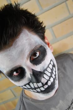 portrait of a creepy skeleton guy perfect for Carnival (brick wall background)