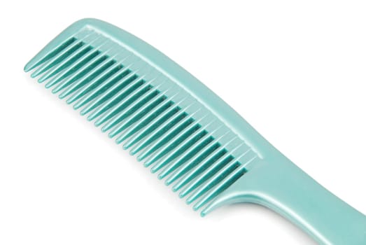 green plastic comb isolated on white background