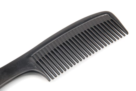 black plastic comb isolated on white background