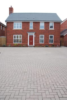 detached and typical british residential house with small entrance garden (isolated on white)