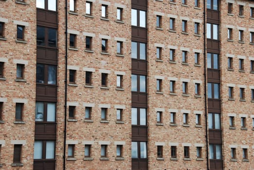 antique brick wall building with windows (british architecure)