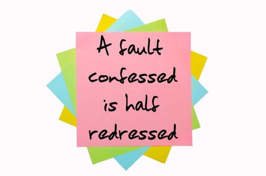 text "A fault confessed is half redressed"" written by hand font on bunch of colored sticky notes"
