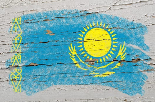 Chalky kazakstan flag painted with color chalk on grunge wooden texture