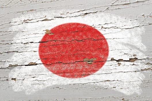 Chalky japanese  flag painted with color chalk on grunge wooden texture