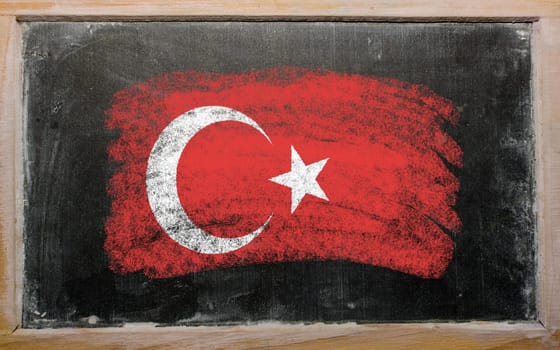 Chalky turkish flag painted with color chalk on old blackboard