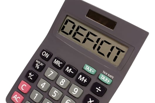 deficit written on display of an old calculator on white background in perspective