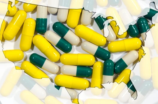 Outline map of USA with yellow and green and white capsules in background