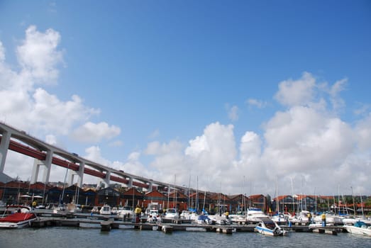 beautiful docks in Lisbon, on the background the typical houses used as restaurants/pubs (under April 25th bridge)