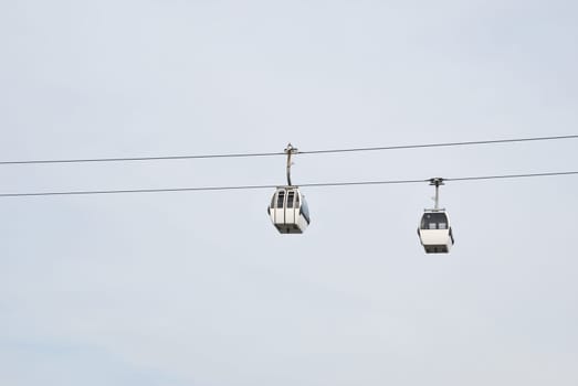 two modern cablecars in Nations Park in Lisbon, Portugal