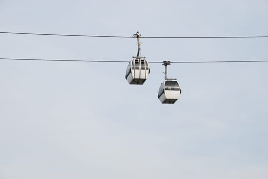 two modern cablecars in Nations Park in Lisbon, Portugal