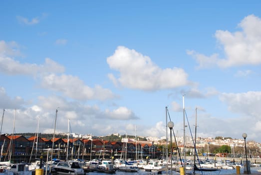 beautiful docks in Lisbon, on the background the typical houses used as restaurants/pubs