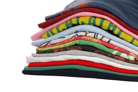 pile of colorful t-shirts isolated on white background
