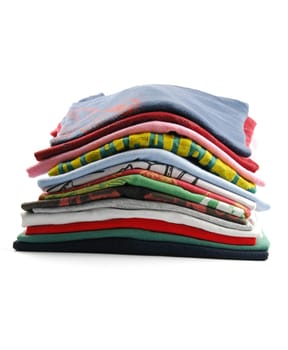 pile of colorful t-shirts isolated on white background