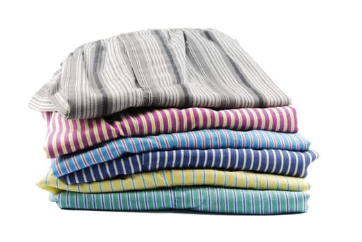 pile of stripped boxer shorts (male underwear) isolated on white background
