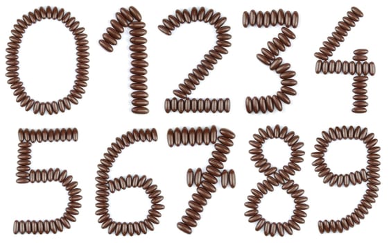 beautiful collection of numbers from 0 to 9 with chocolate candies (isolated on white background)