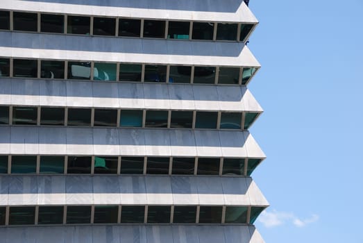 modern office building against blue sky background