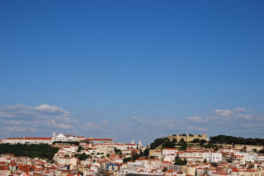 beautiful cityscape of Lisbon with Graça Church and Sao Jorge Castle, Portugal (from left to right)