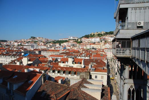beautiful cityscape of Lisbon with Graça Church, Sao Jorge Castle and Santa Justa Elevator, Portugal (from left to right)