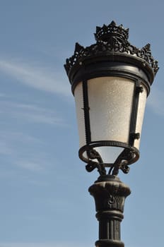 vintage lamp post against blue sky background