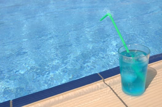 gorgeous blue corazon cocktail at the pool side